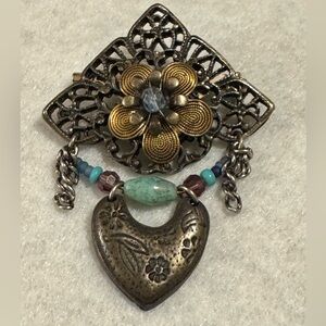 Vintage Cara Stimmel silvertone and brass flower with heart brooch